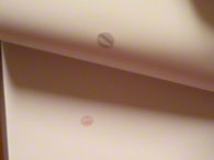 A LARGE DROP OF BLOOD SERUM ALSO MIRACULOUSLY LIQUEFIED and dropped onto the white paper it was on and went thru 3 thick pages! The apparent great heat from Padre Pio’s drop of blood (his blood registered extremely hot: over 127°F)CAUSED ALL 3 PAGES TO WARP AND BEND UP UNDER HIS DROP OF BLOOD! This is shown above in the photo of this second page with Padre Pio’s blood on it!